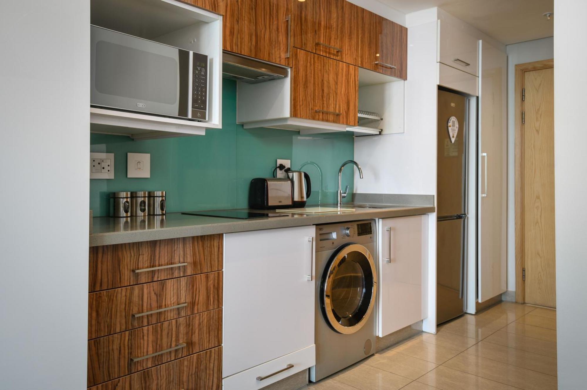 The Capital Pearls Hotel Durban Esterno foto A typical kitchen in a serviced apartment